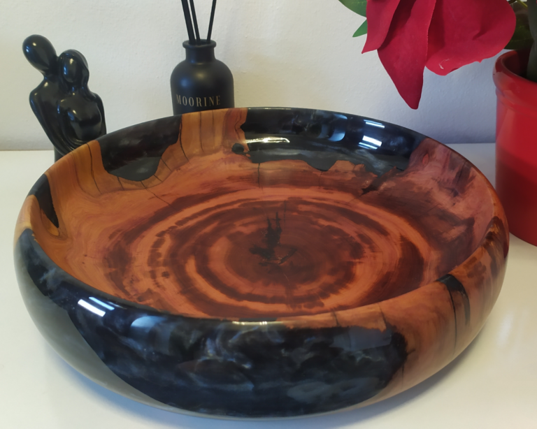 Time engraved in wood, sealed in a dark, glossy sheen.